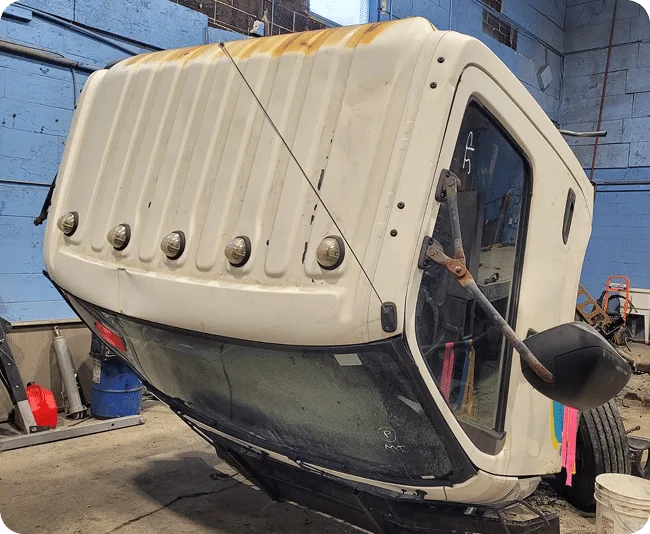 Truck cab tilted in garage